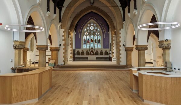 Image shows the inside of a church, looking towards the altar